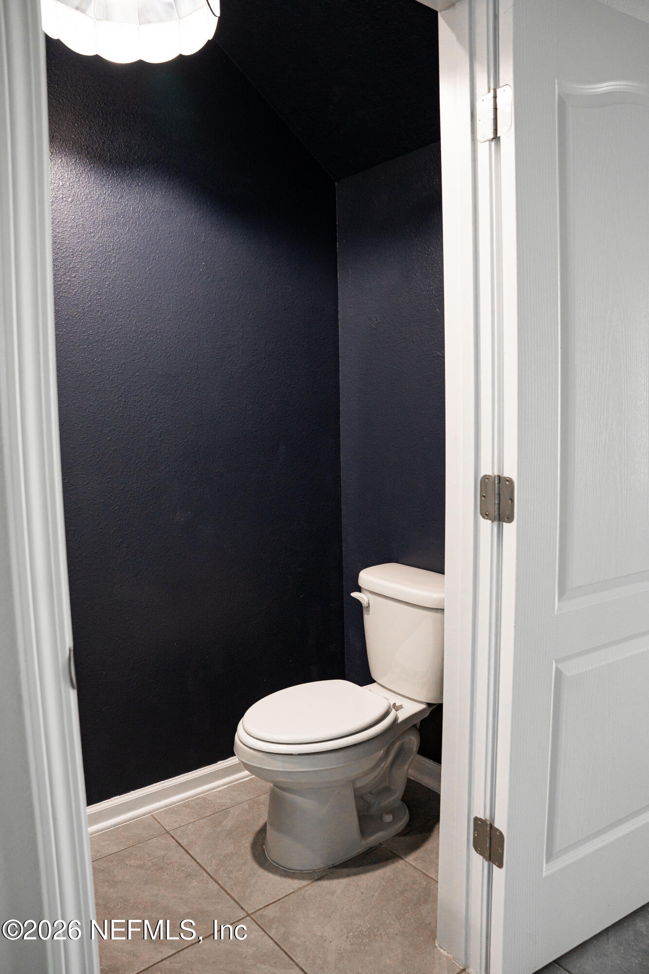 46 Wading Ibis Road St. Augustine, FL 32095 - Photo 13 of 31 a white toilet sitting next to a shower