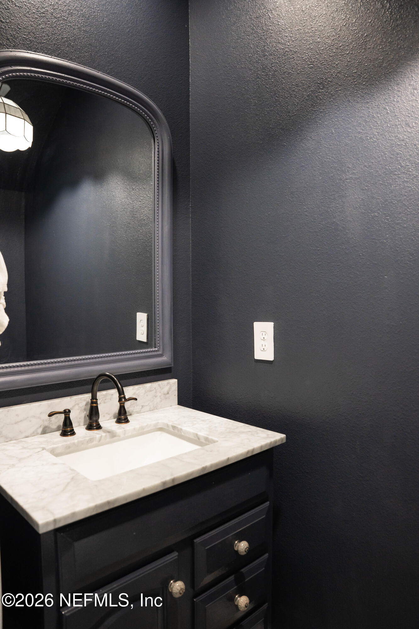46 Wading Ibis Road St. Augustine, FL 32095 - Photo 16 of 31 a bathroom with a sink and a mirror