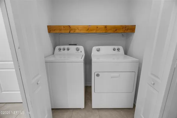 a utility room with dryer and washer