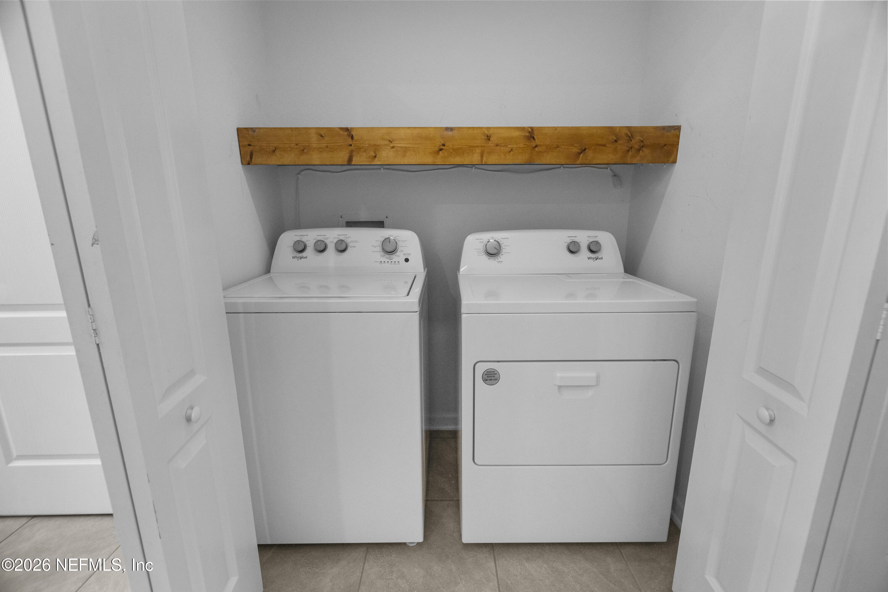 46 Wading Ibis Road St. Augustine, FL 32095 - Photo 18 of 31 a utility room with dryer and washer