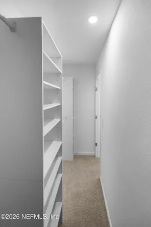 a view of an empty walk in closet