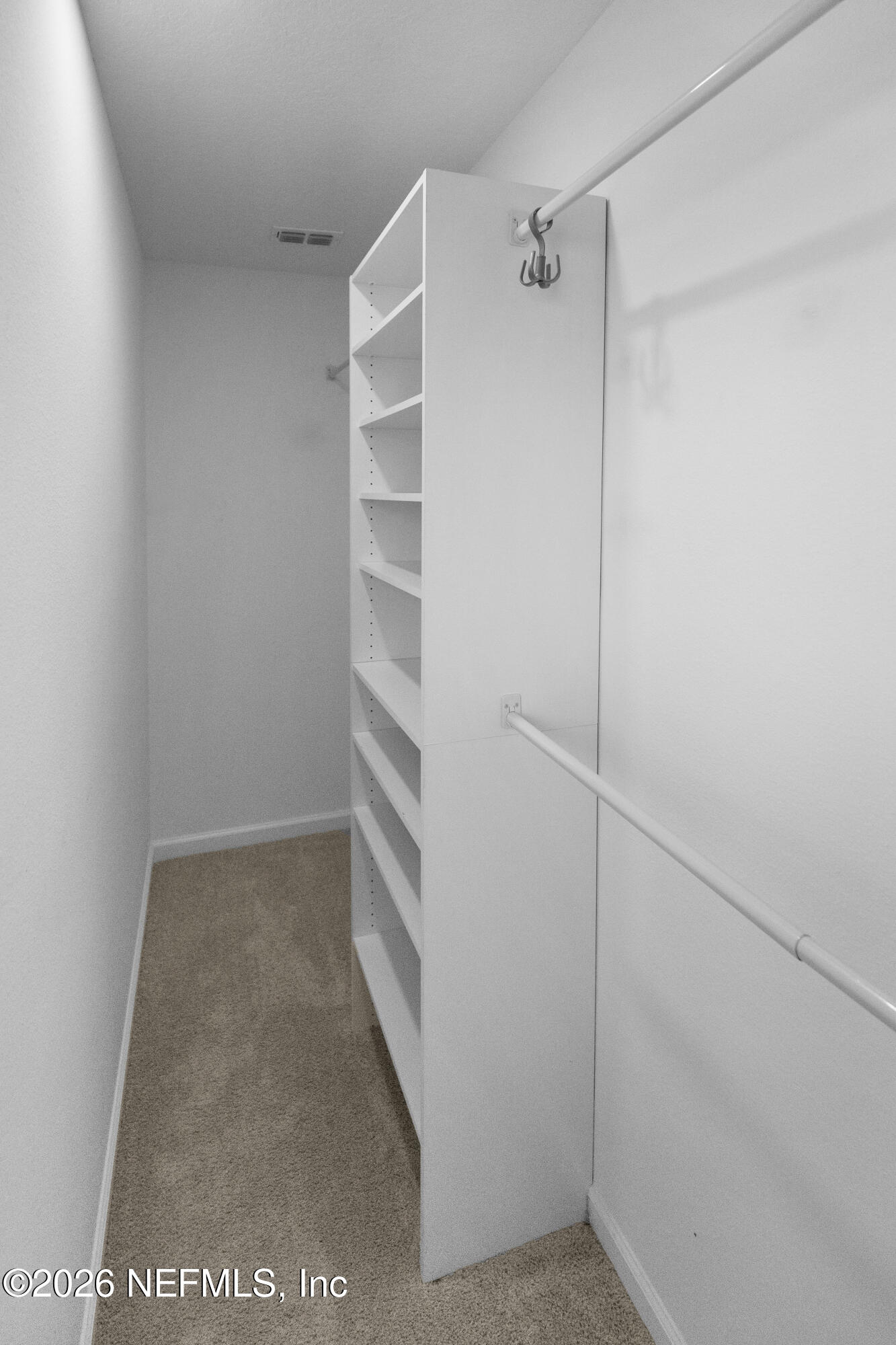 46 Wading Ibis Road St. Augustine, FL 32095 - Photo 22 of 31 a view of walk in closet with empty racks