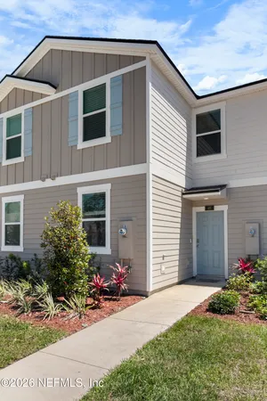 a front view of a house with yard