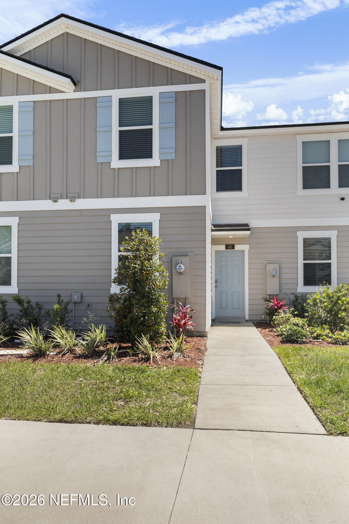 46 Wading Ibis Road St. Augustine, FL 32095 - Photo 4 of 31 a front view of a house with a yard and outdoor seating