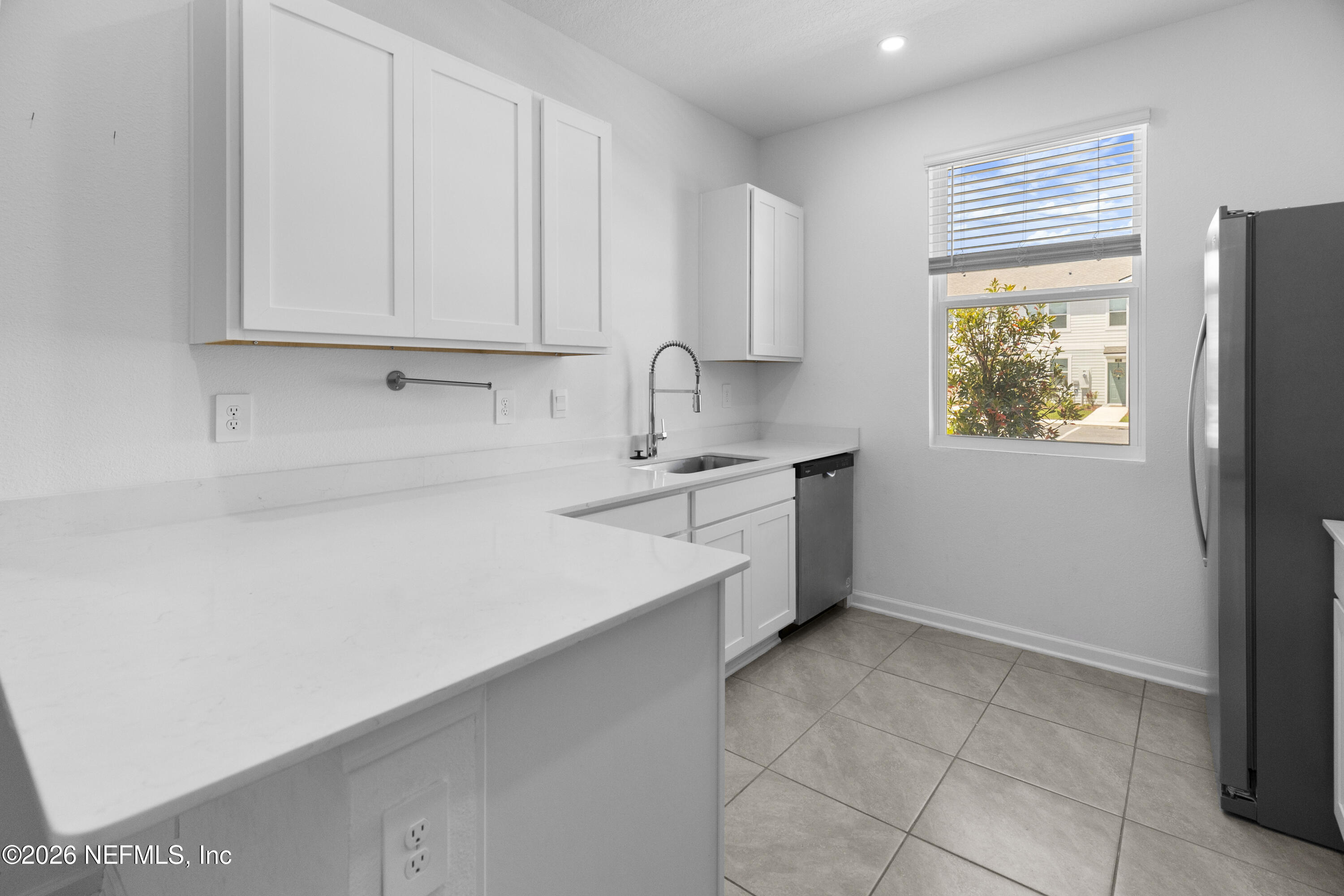 46 Wading Ibis Road St. Augustine, FL 32095 - Photo 6 of 31 a kitchen with a sink cabinets and window