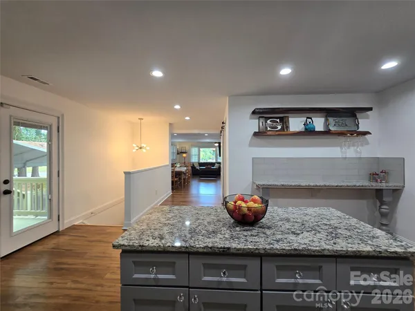 a kitchen with counter top space cabinets and appliances