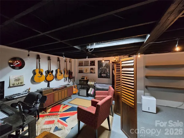 a room with furniture and musical instruments