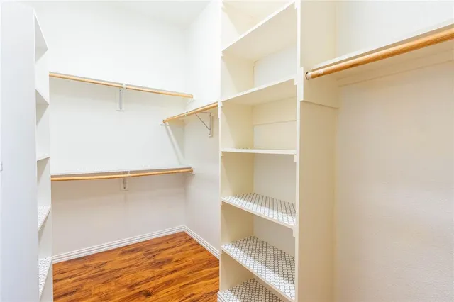 a view of an empty walk in closet