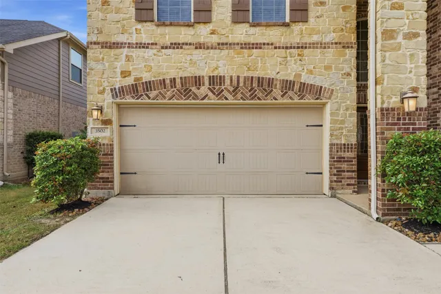 a view of a hallway with kitchen view and a window