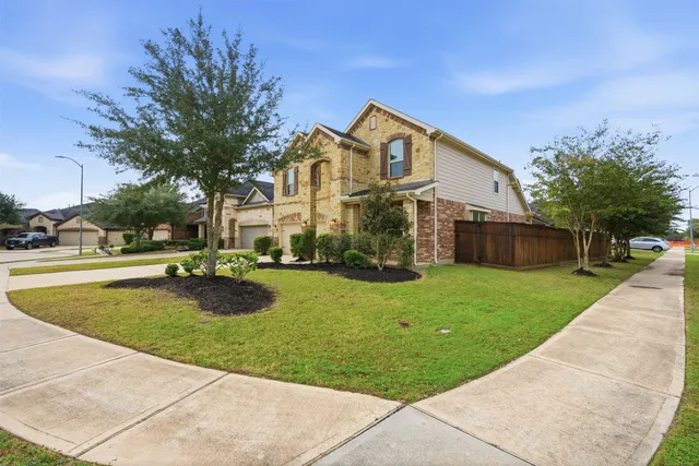 a kitchen with granite countertop a stove top oven microwave and cabinets