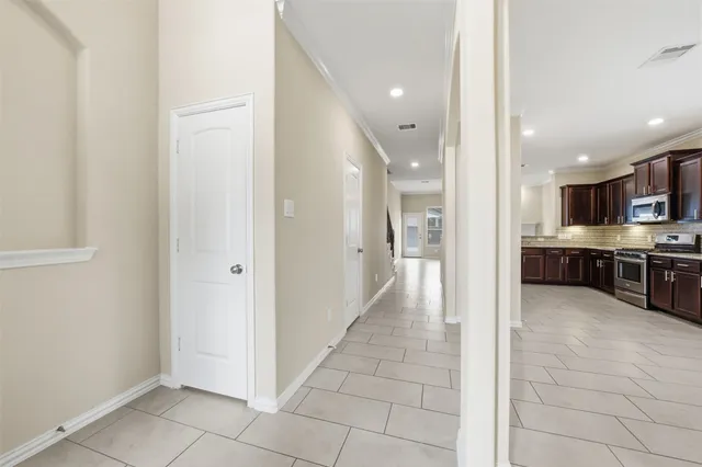 a bathroom with a granite countertop sink a toilet and a mirror
