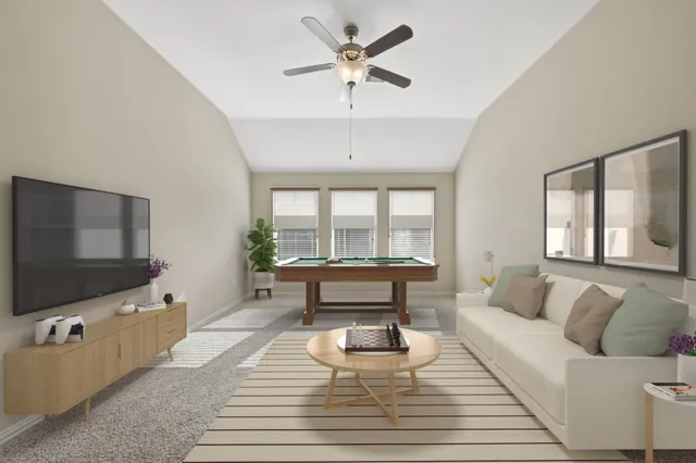 a living room with furniture and a flat screen tv