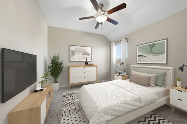 a bedroom with a bed and a potted plant