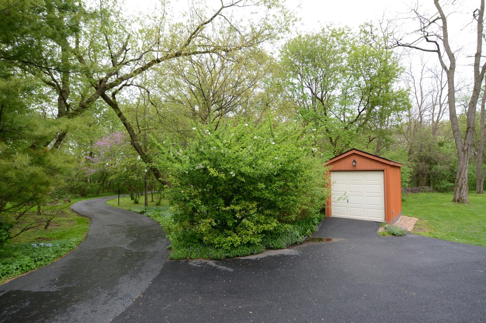 37W271 Weld Road Elgin, IL 60124 - Photo 25 of 34 a front view of a house with a yard and garage