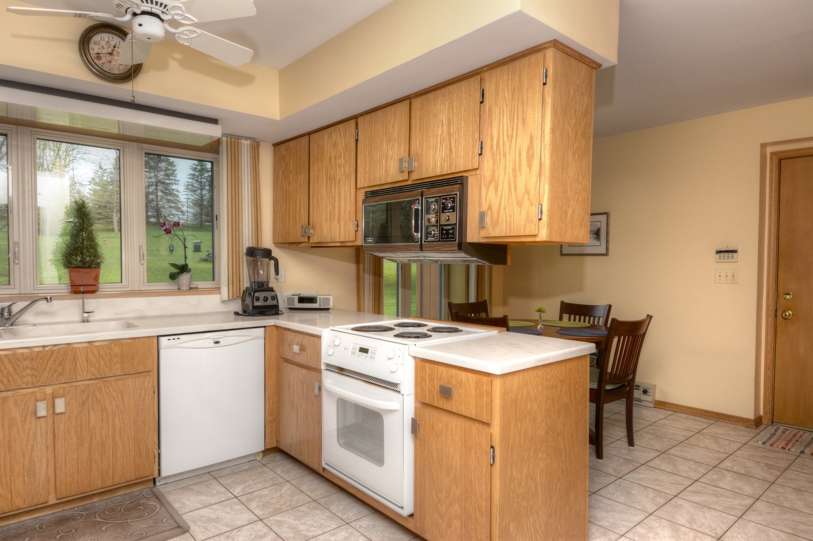 37W271 Weld Road Elgin, IL 60124 - Photo 8 of 34 a kitchen with a stove a sink and a microwave