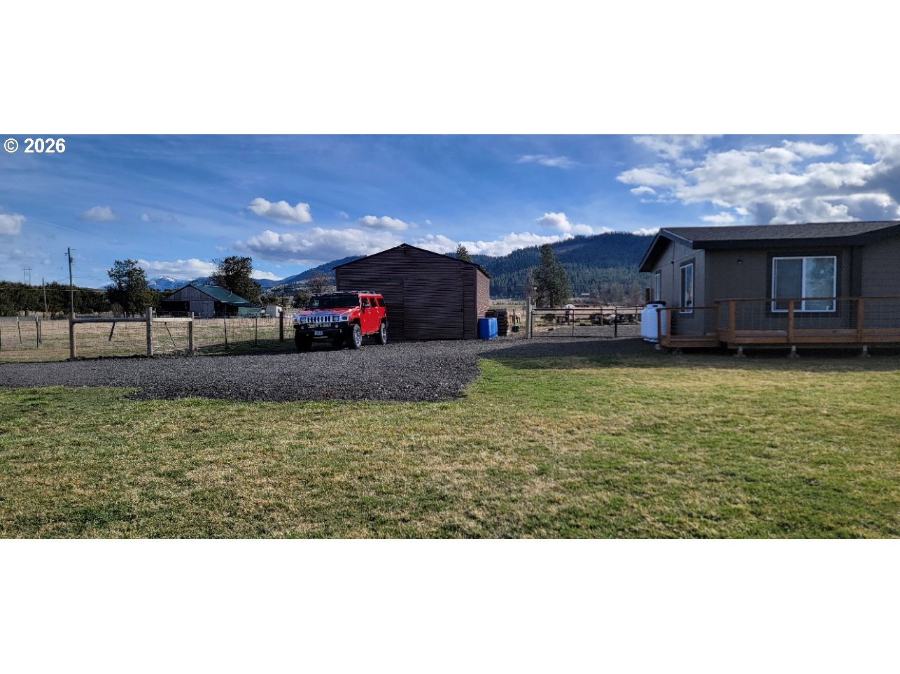 70724 Bear Creek Road Wallowa, OR 97885 - Photo 39 of 44 a view of a house with a yard