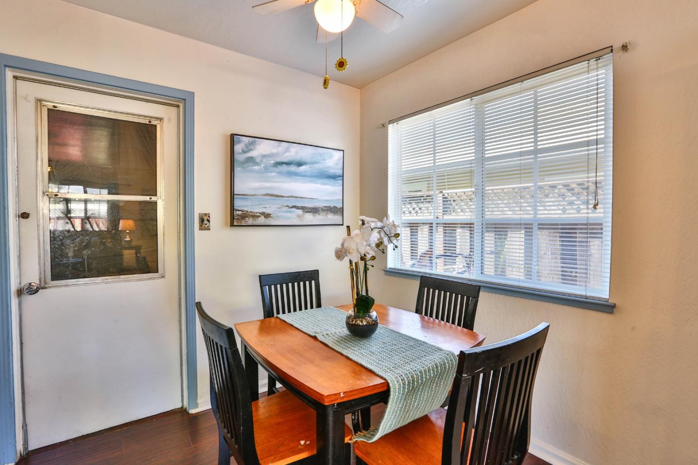 1735 Cunningham Street Santa Clara, CA 95050 - Photo 15 of 38 a view of a dining room with furniture window and wooden floor
