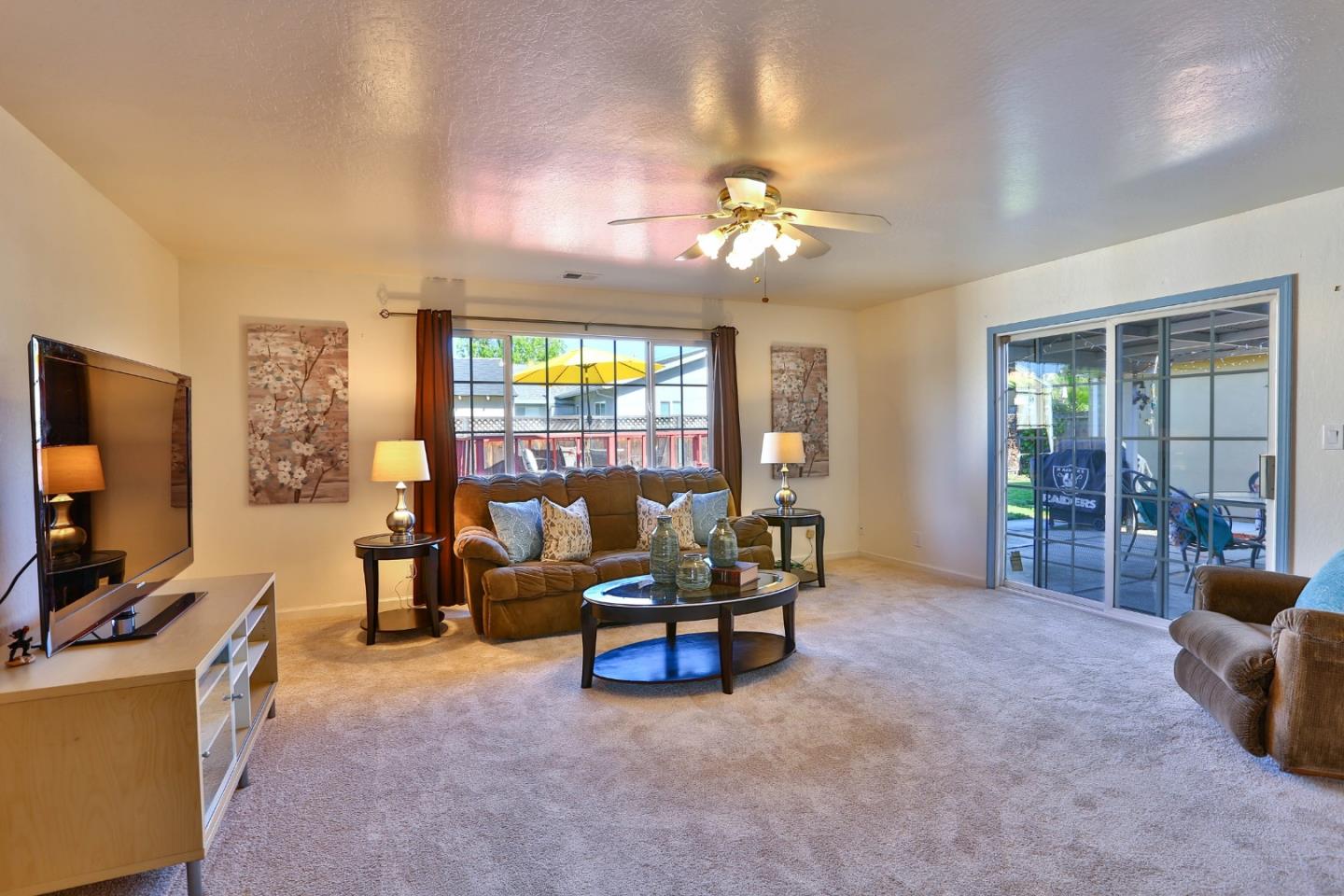 1735 Cunningham Street Santa Clara, CA 95050 - Photo 17 of 38 a living room with furniture and a flat screen tv