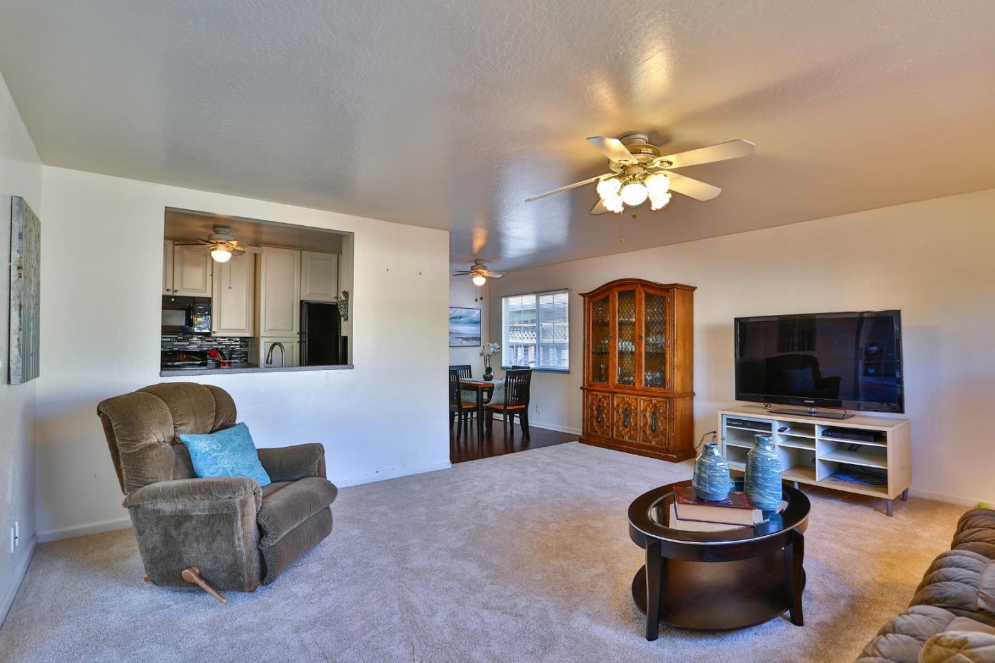 1735 Cunningham Street Santa Clara, CA 95050 - Photo 18 of 38 a living room with furniture and a flat screen tv