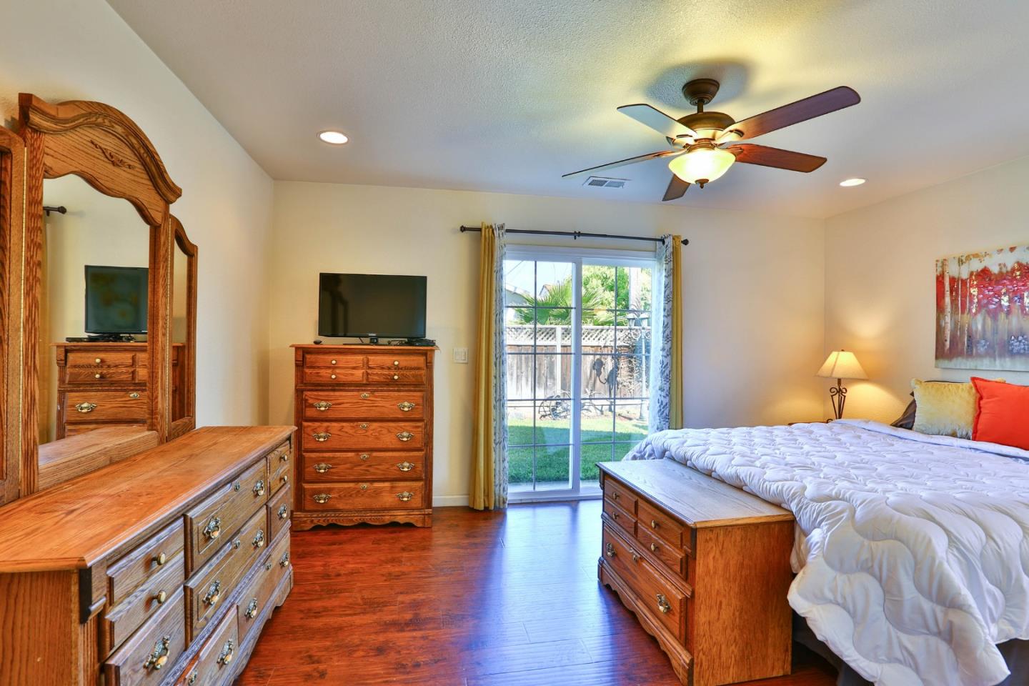 1735 Cunningham Street Santa Clara, CA 95050 - Photo 20 of 38 a bedroom with a bed and wooden floor