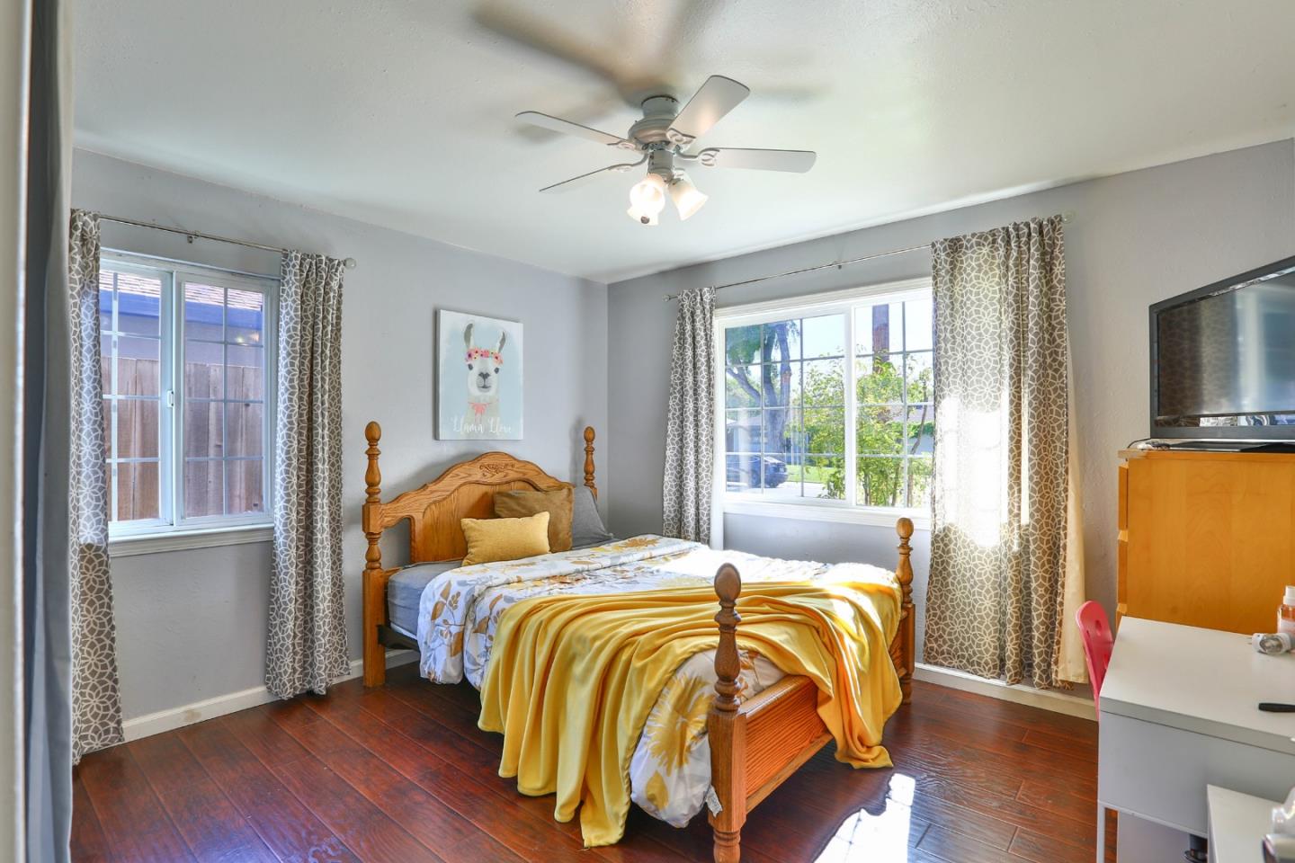 1735 Cunningham Street Santa Clara, CA 95050 - Photo 25 of 38 a bedroom with bed and wooden floor