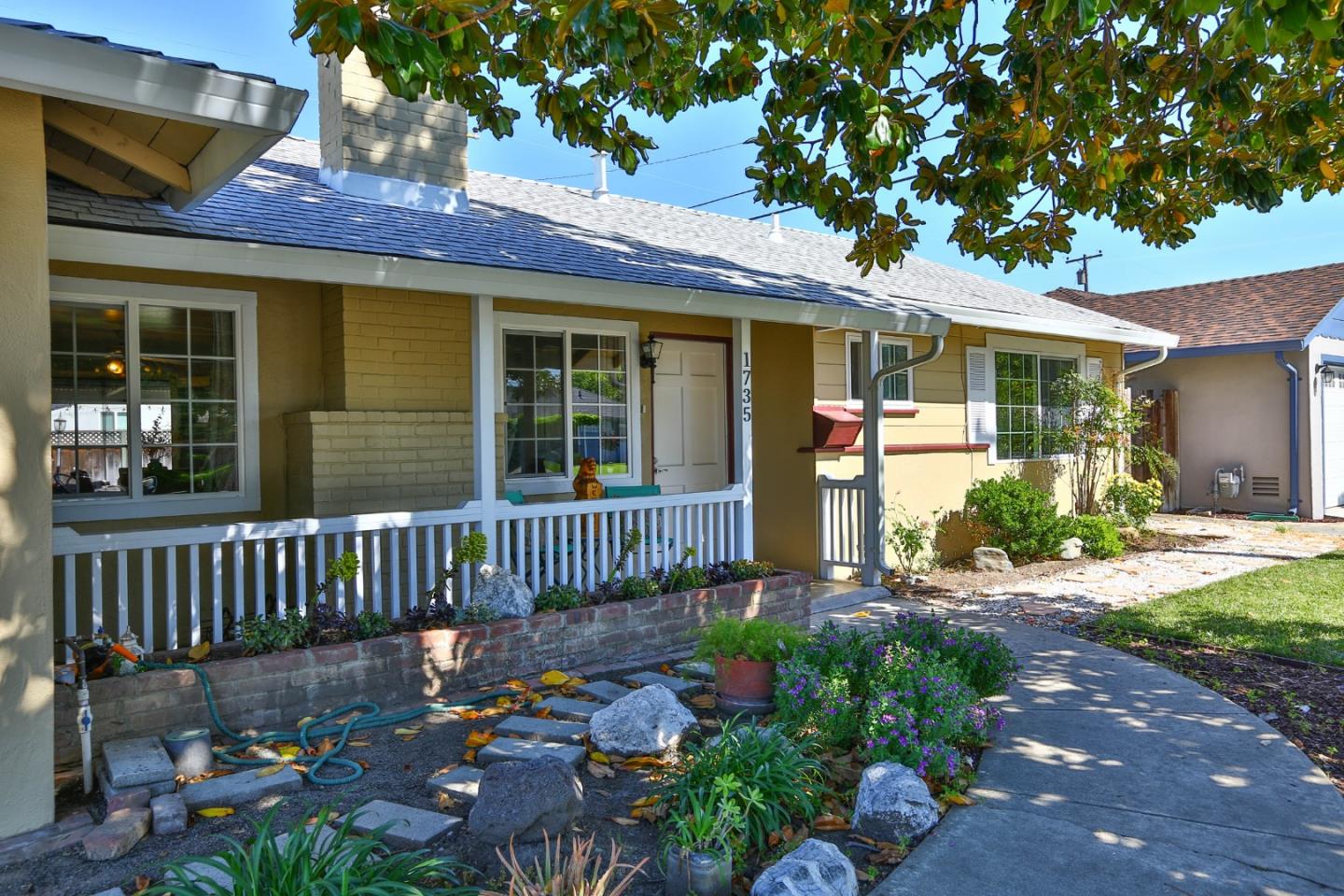 1735 Cunningham Street Santa Clara, CA 95050 - Photo 5 of 38 a front view of a house with a garden