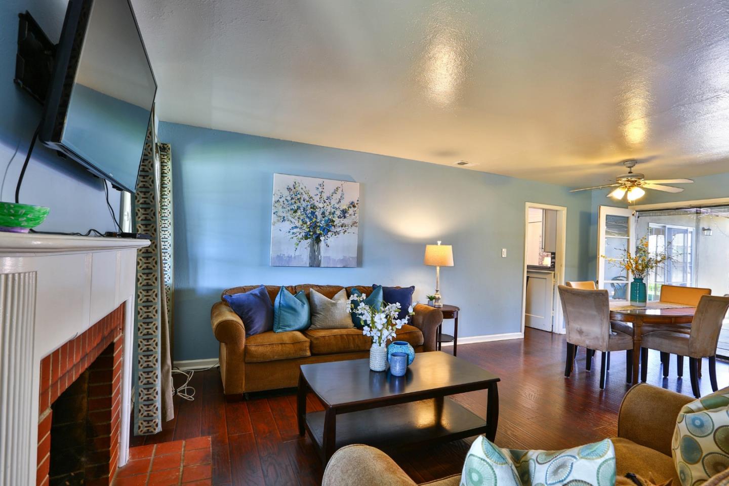 1735 Cunningham Street Santa Clara, CA 95050 - Photo 7 of 38 a living room with furniture and a fireplace