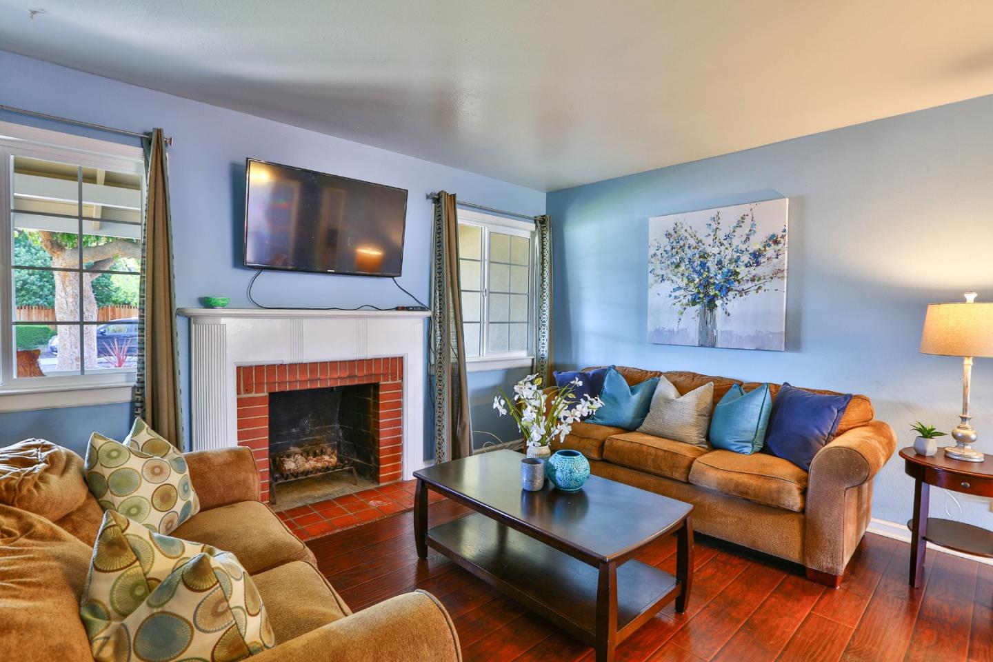 1735 Cunningham Street Santa Clara, CA 95050 - Photo 8 of 38 a living room with furniture and a fireplace