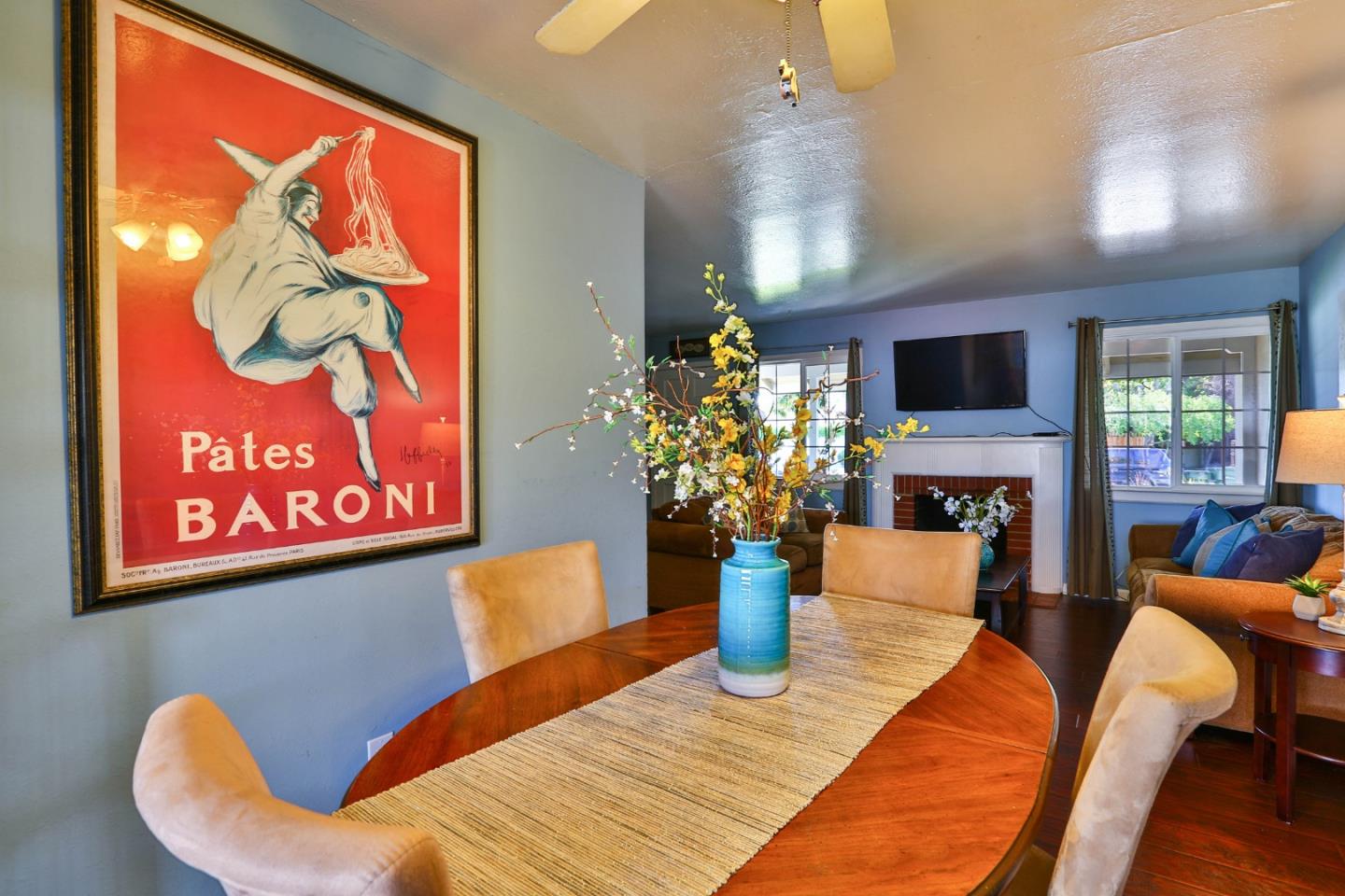 1735 Cunningham Street Santa Clara, CA 95050 - Photo 10 of 38 a view of a dining room with furniture a fireplace and potted plants