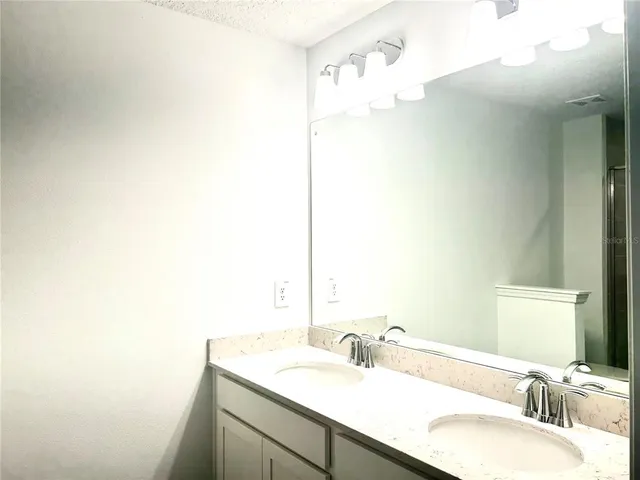 a bathroom with a shower and toilet