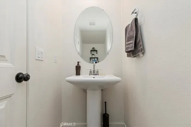 a bathroom with a sink and mirror