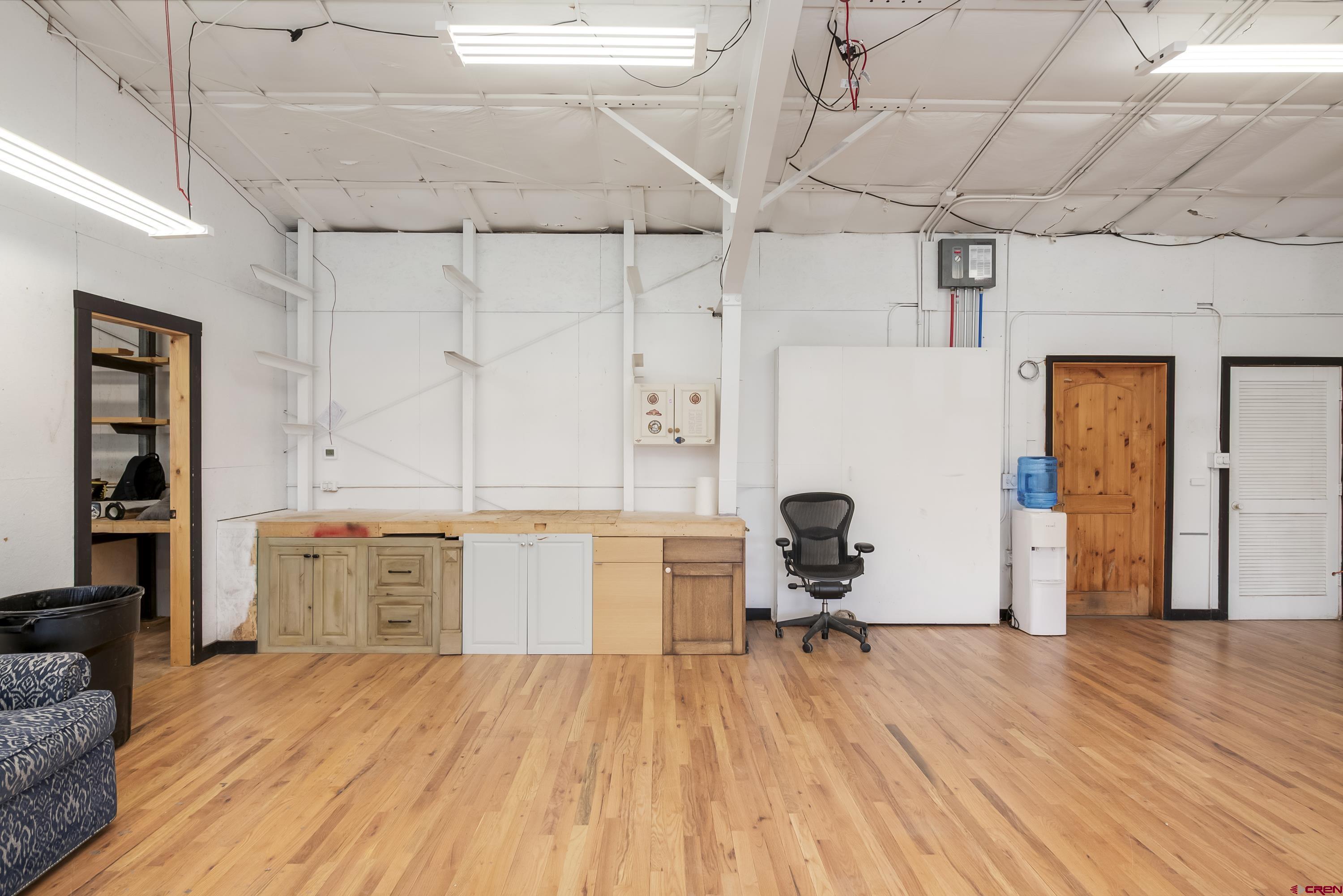 110 Andreas Circle, Unit A Crested Butte, CO 81224 - Photo 9 of 21 a view of a kitchen with a sink and wooden floor