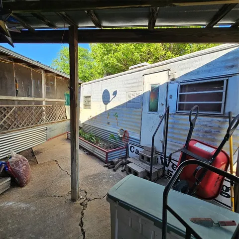 a roof deck with a table and chairs
