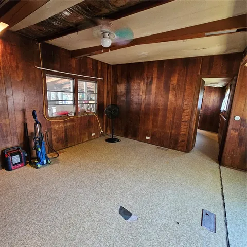 a view of a livingroom with furniture and windows