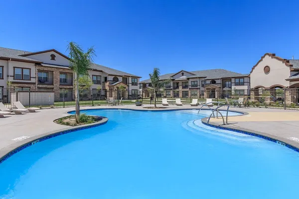 a swimming pool with outdoor seating and yard