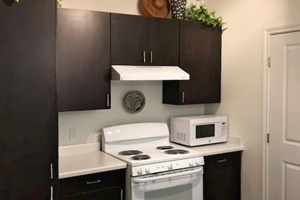 a kitchen with a stove and a microwave