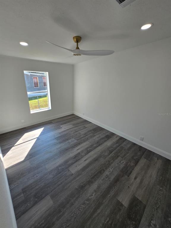 4928 Rollinglen Loop East Lakeland, FL 33810 - Photo 11 of 44 wooden floor in an empty room