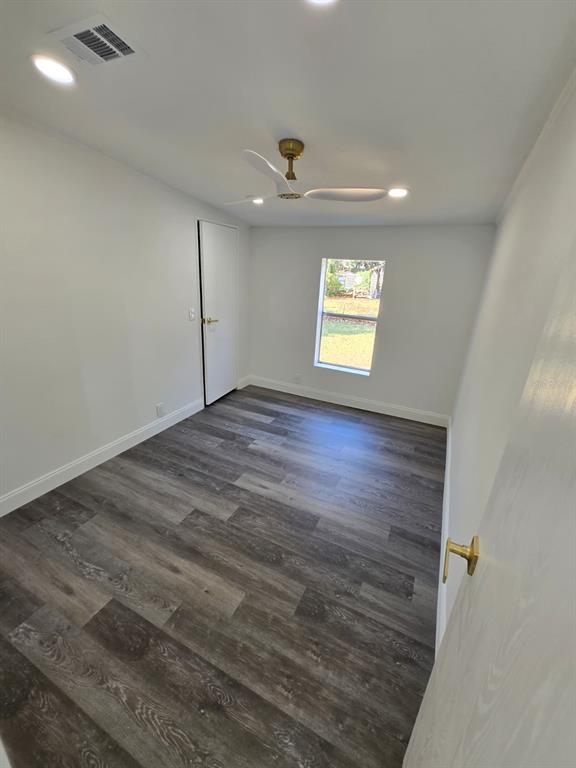 4928 Rollinglen Loop East Lakeland, FL 33810 - Photo 18 of 44 an empty room with windows and ceiling fan