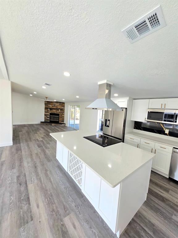 4928 Rollinglen Loop East Lakeland, FL 33810 - Photo 24 of 44 a large white kitchen with sink stove and refrigerator