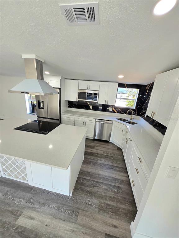 4928 Rollinglen Loop East Lakeland, FL 33810 - Photo 34 of 44 a large white kitchen with cabinets