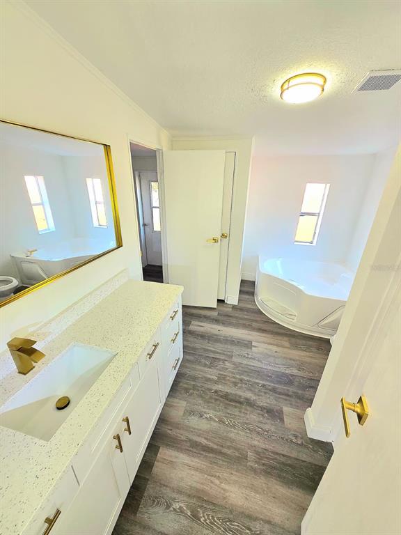 4928 Rollinglen Loop East Lakeland, FL 33810 - Photo 35 of 44 a large white bed in a white room