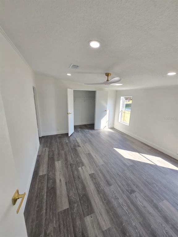 4928 Rollinglen Loop East Lakeland, FL 33810 - Photo 36 of 44 wooden floor in an empty room with a window