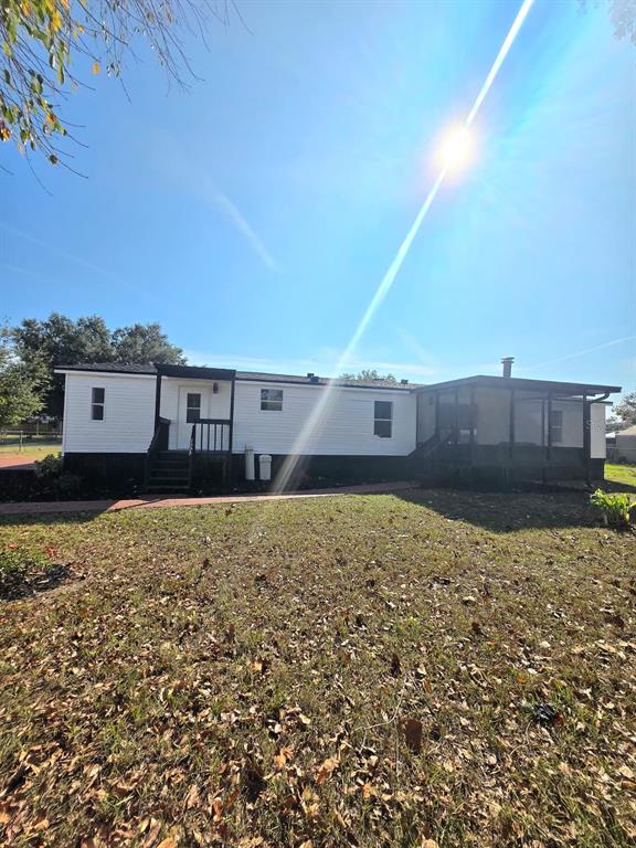 4928 Rollinglen Loop East Lakeland, FL 33810 - Photo 7 of 44 a front view of a house with a yard