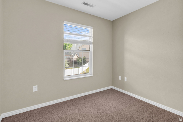 14108 Pepi Band Road Draper, UT 84020 - Photo 26 of 36 Neutral tone walls with white trim and brown carpeting