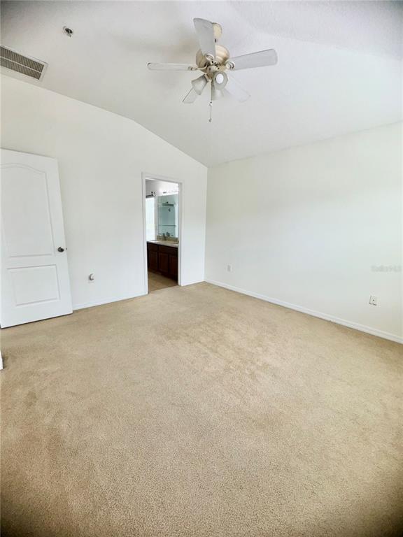 6404 South Goldenrod Road, Unit 2A Orlando, FL 32822 - Photo 36 of 40 an empty room with chandelier fan