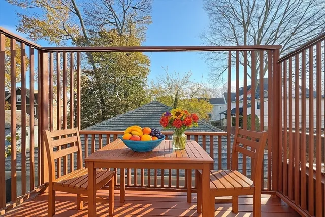 a view of a room with wooden floor and window