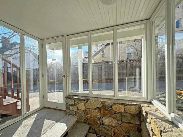 a kitchen with cabinets and washer dryer