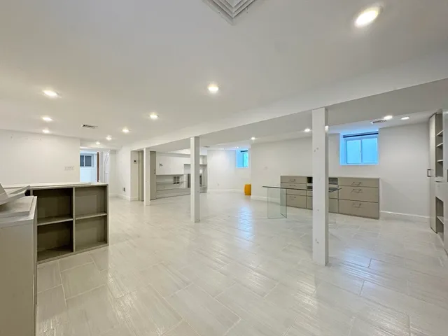 a kitchen with stainless steel appliances granite countertop a stove microwave and sink