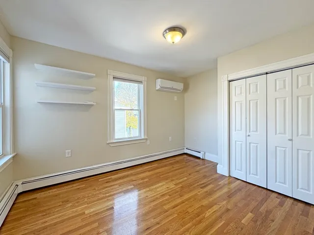 a bathroom with a double vanity sink a mirror and a shower
