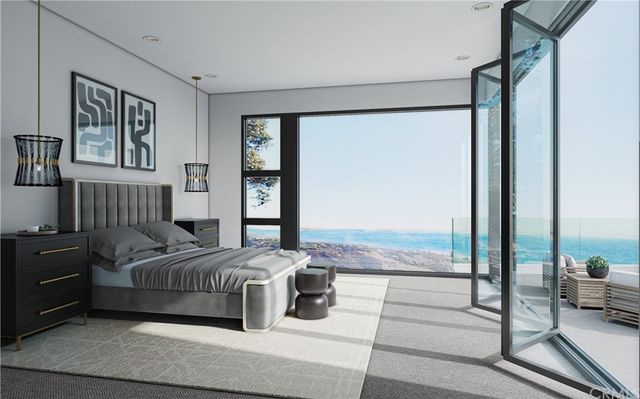 an aerial view of residential building and ocean view